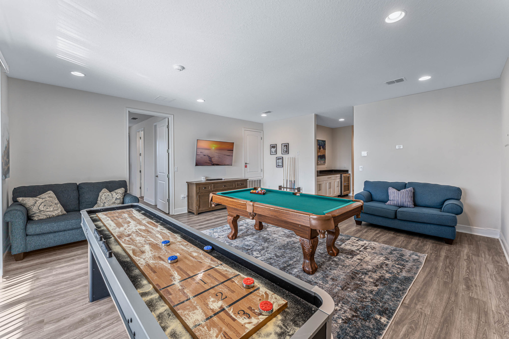 loft with game tables and couches